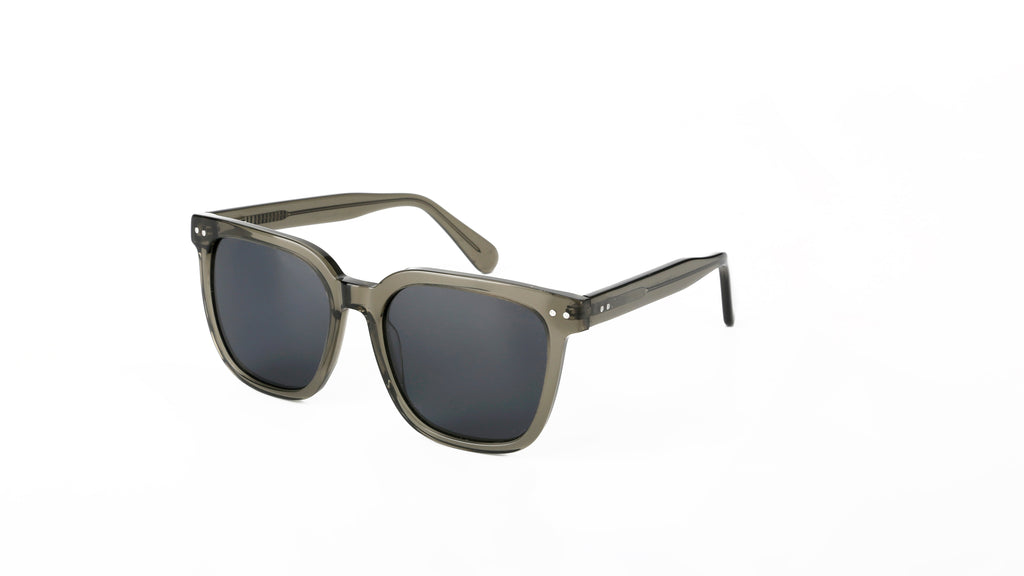 Oversized square sunglasses with a translucent olive green acetate frame and dark gray lenses, shown on a plain white background.