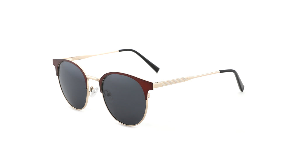 Oversized round sunglasses with dark gray lenses, a dark reddish-brown acetate front, and slim gold metal temples with black tips, shown on a plain white background.