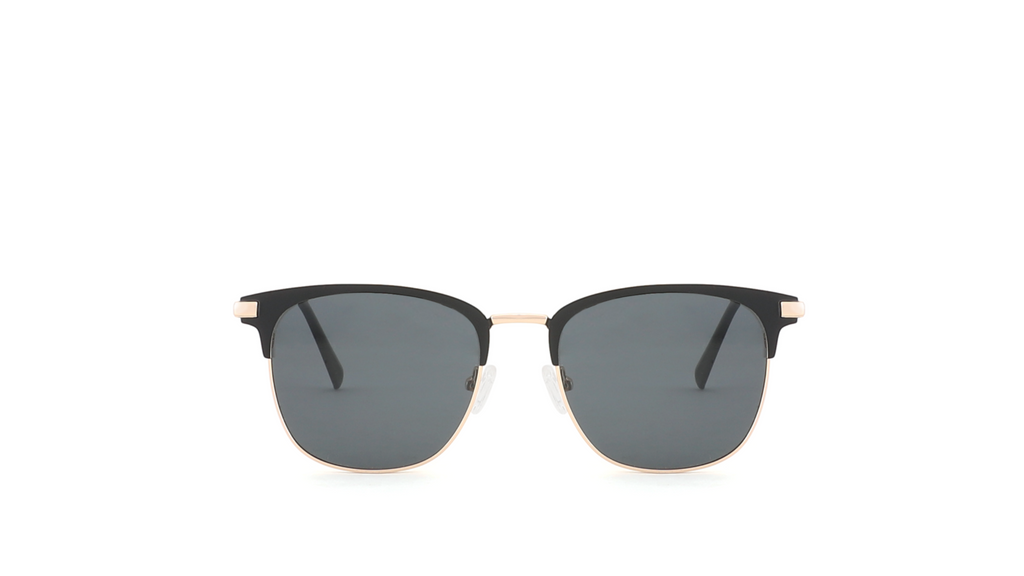A pair of classic half-relief sunglasses with dark gray lenses and a thin black metal frame, centered on a solid white background.