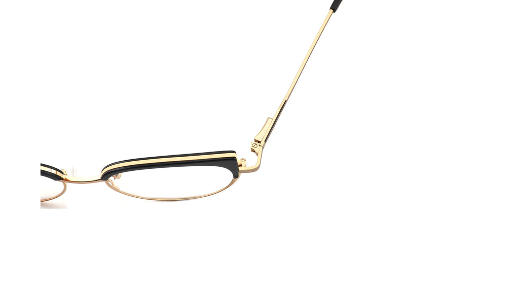 A close-up side view of a pair of eyeglasses featuring a gold metal frame and temples with black acetate detailing on the front rims, set against a plain white background.