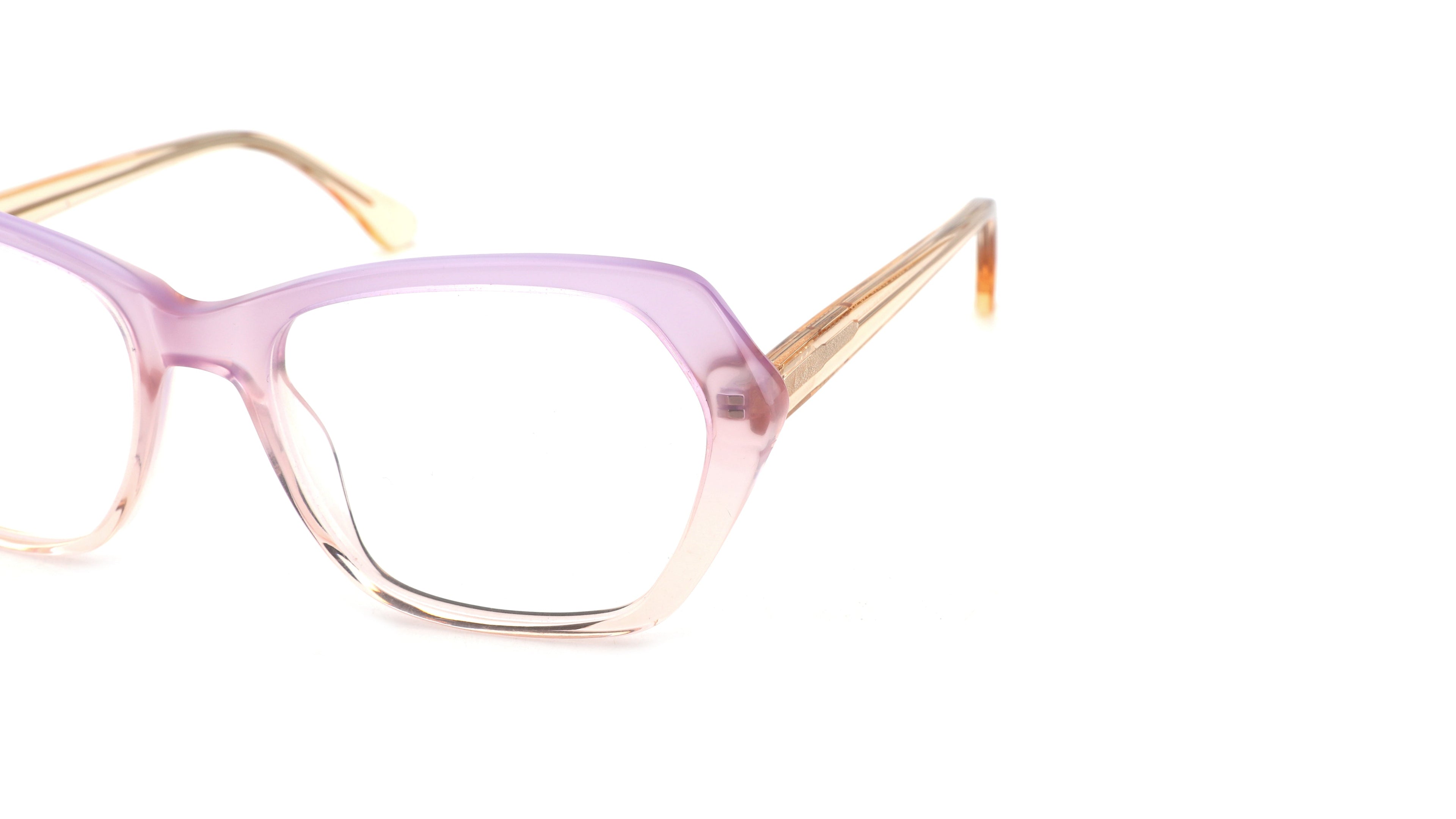 A pair of cat-eye style eyeglasses featuring a translucent lavender-pink frame that fades into a pale peach, with gold metal temples, shown on a plain white background.