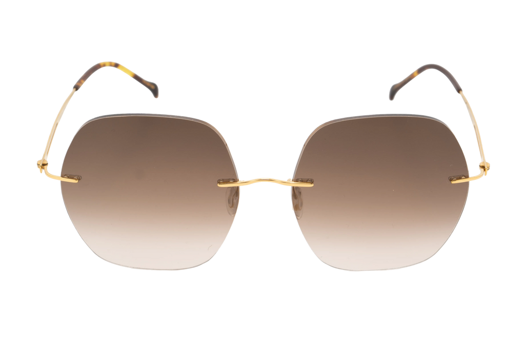 Sunglasses with gold frame and gradient lenses on a white background